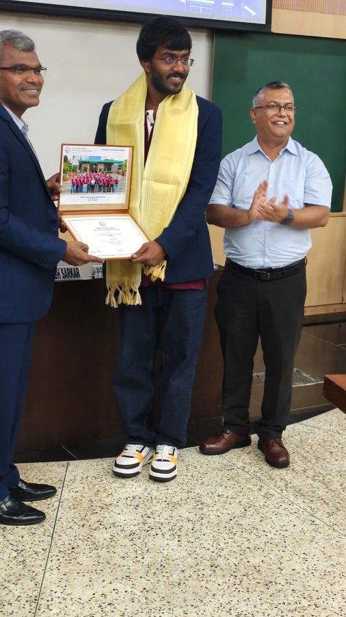 Lav Mishra (centre), Founder & CEO of cyberkul, receiving an award